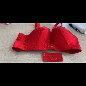 Red lace front padded bra with pink rhinestone.